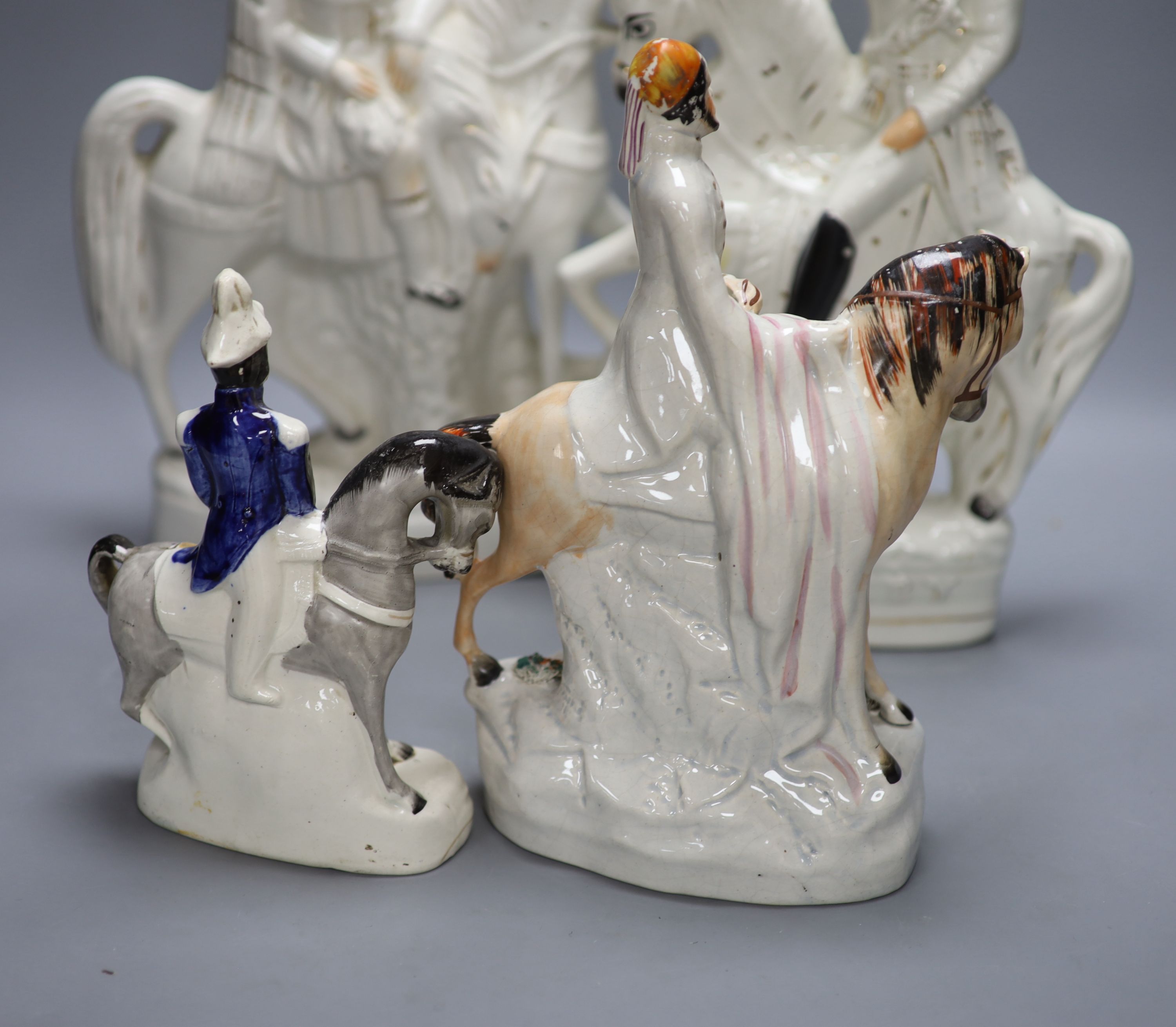 Four 19th century Staffordshire flatbacks, tallest 38cm